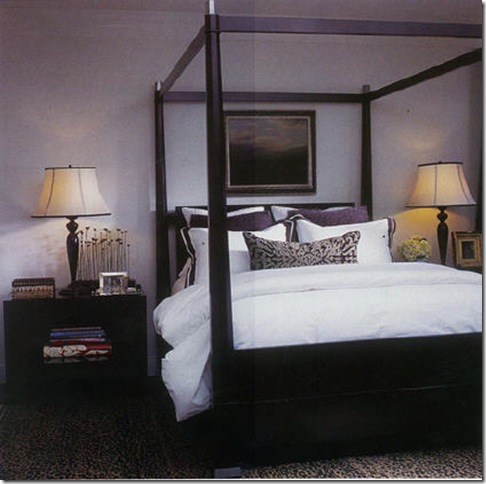 The bedroom features a Baker four poster bed and Barbara Barry end